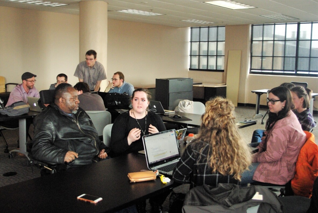 WAT collaborators discussing an accessibility design iteration